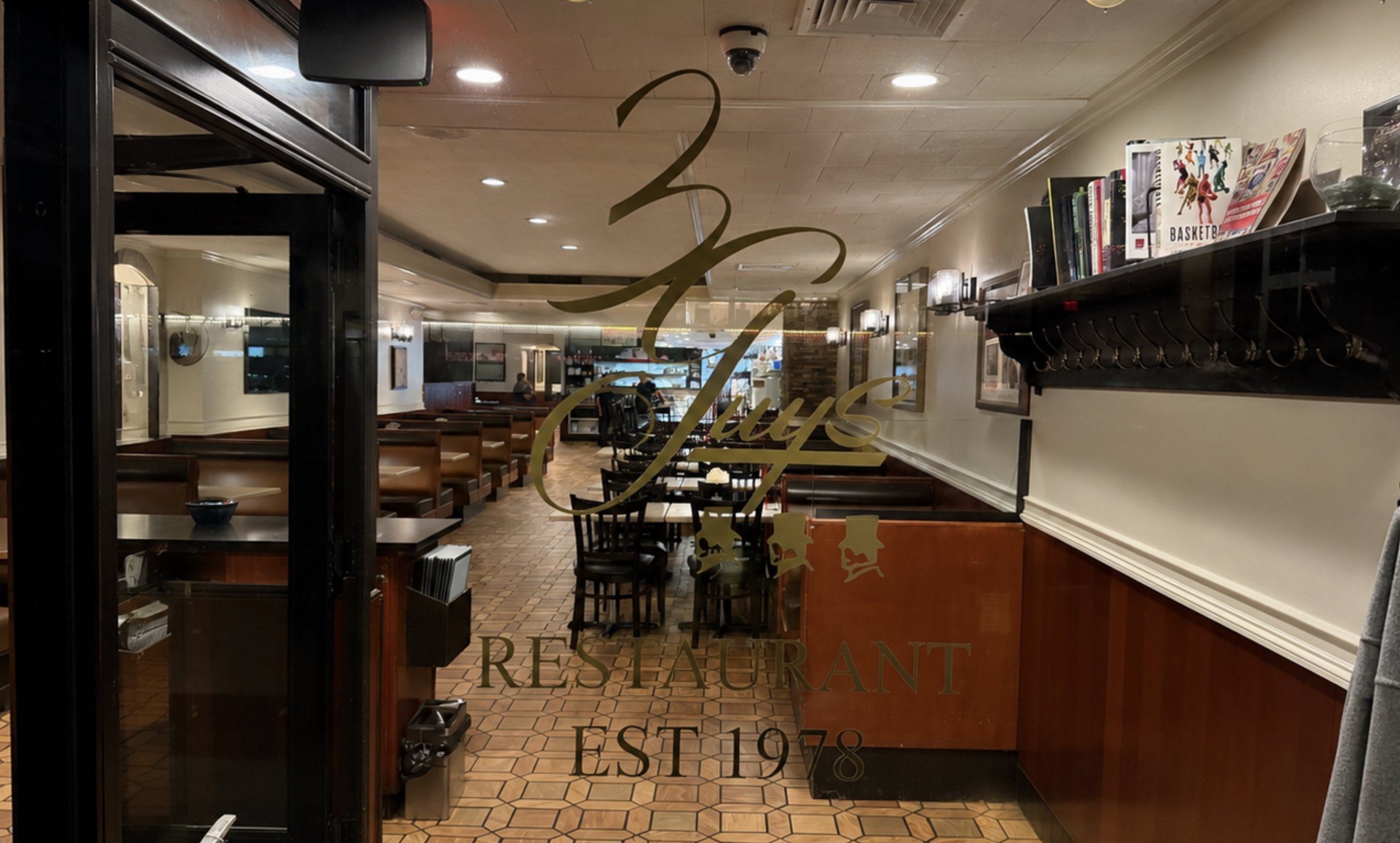 Three Guys storefront window looking into the Madison Avenue dining room.